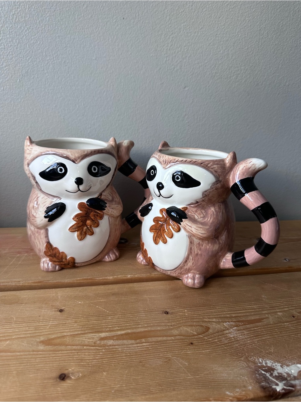 Set of 2- Pier 1 Imports Ceramic Figural Raccoon with Leaves Coffee Mug Tea Cup